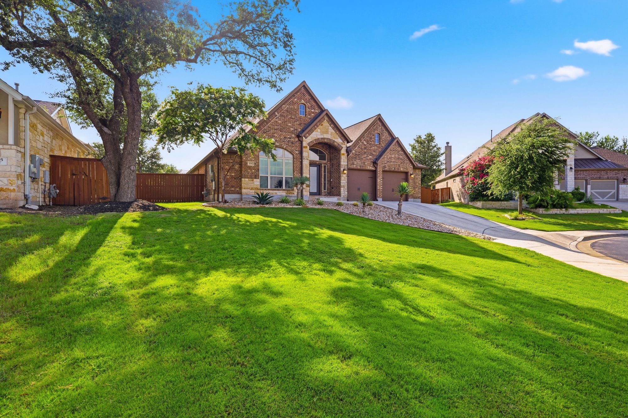 Front lawn beneath a mature shade tree