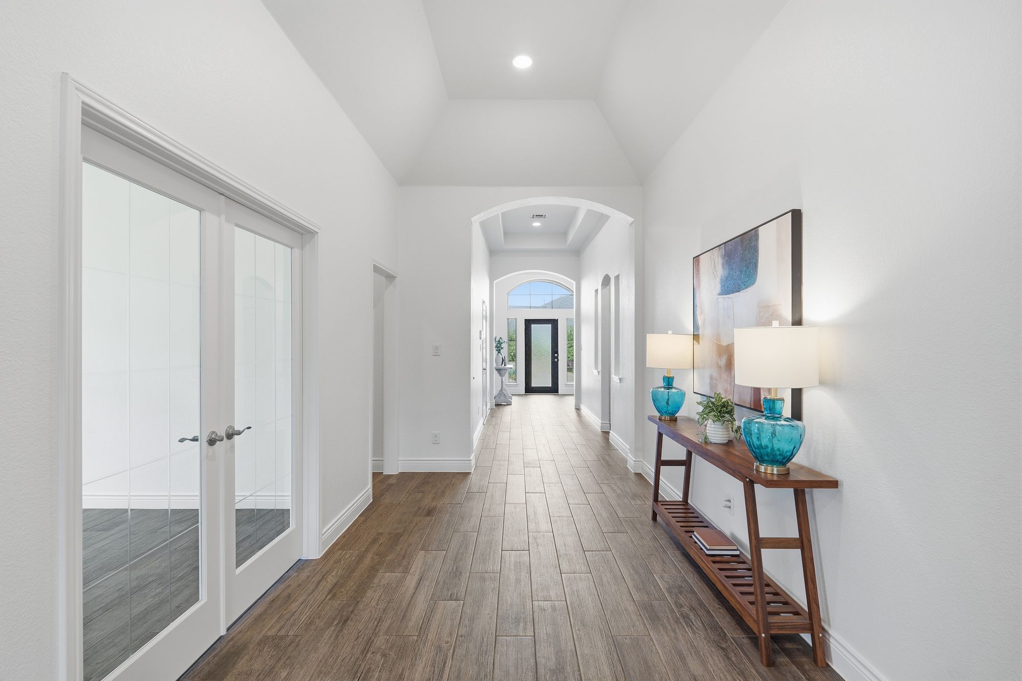 Wide entry hall with wood-look tile