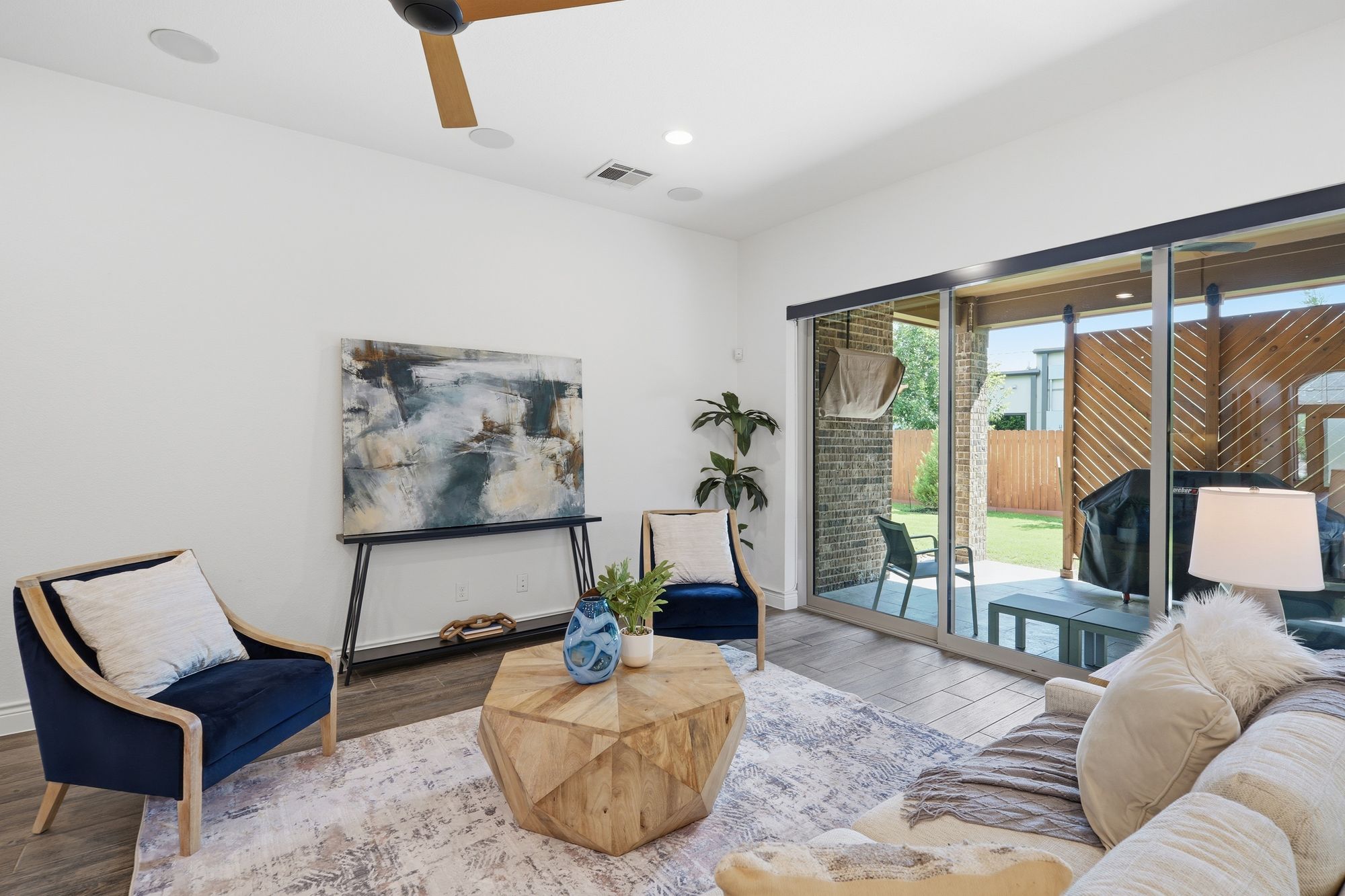 Living room with the triple sliding glass wall