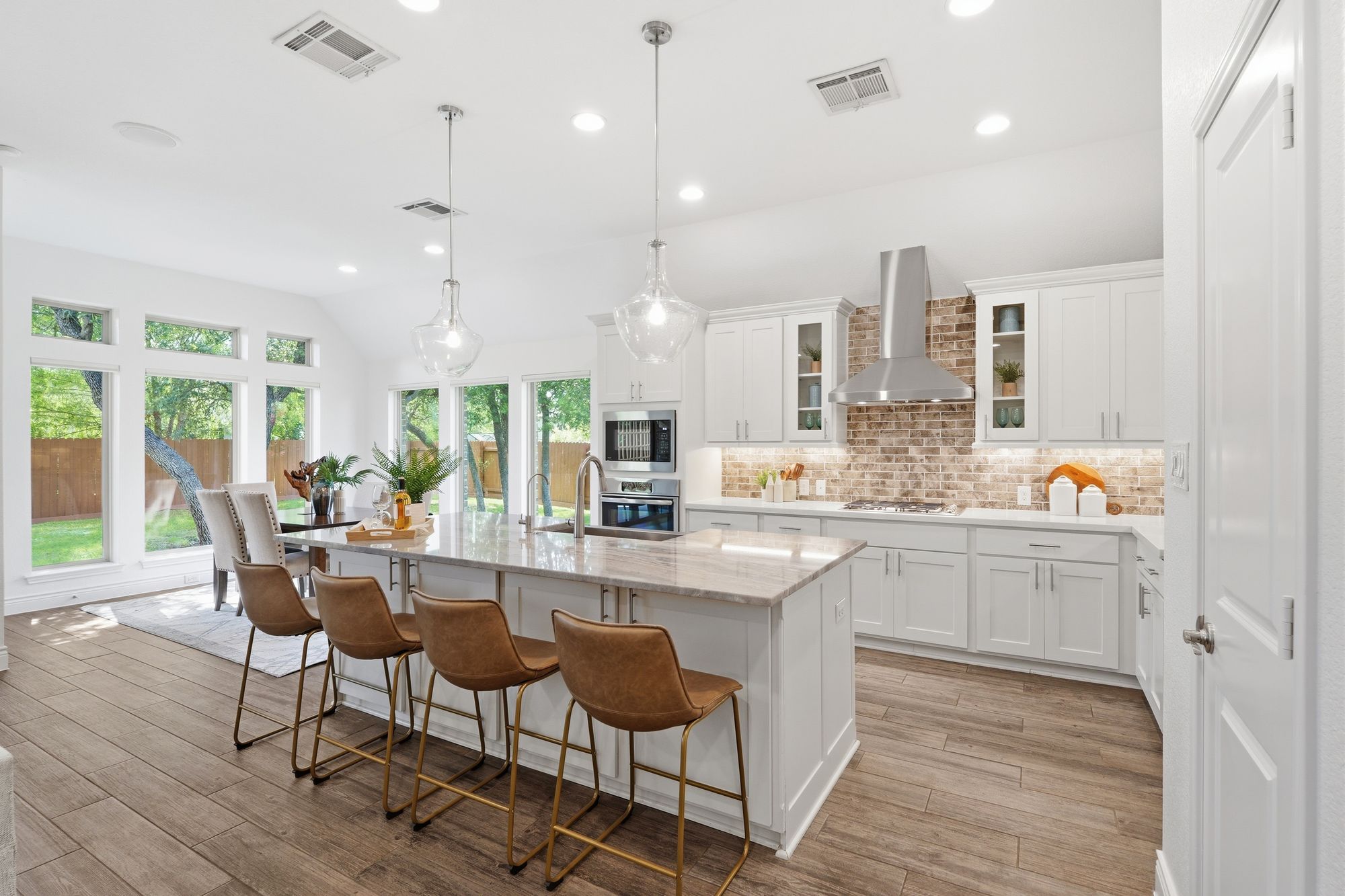 Kitchen with quartz island and bar seating