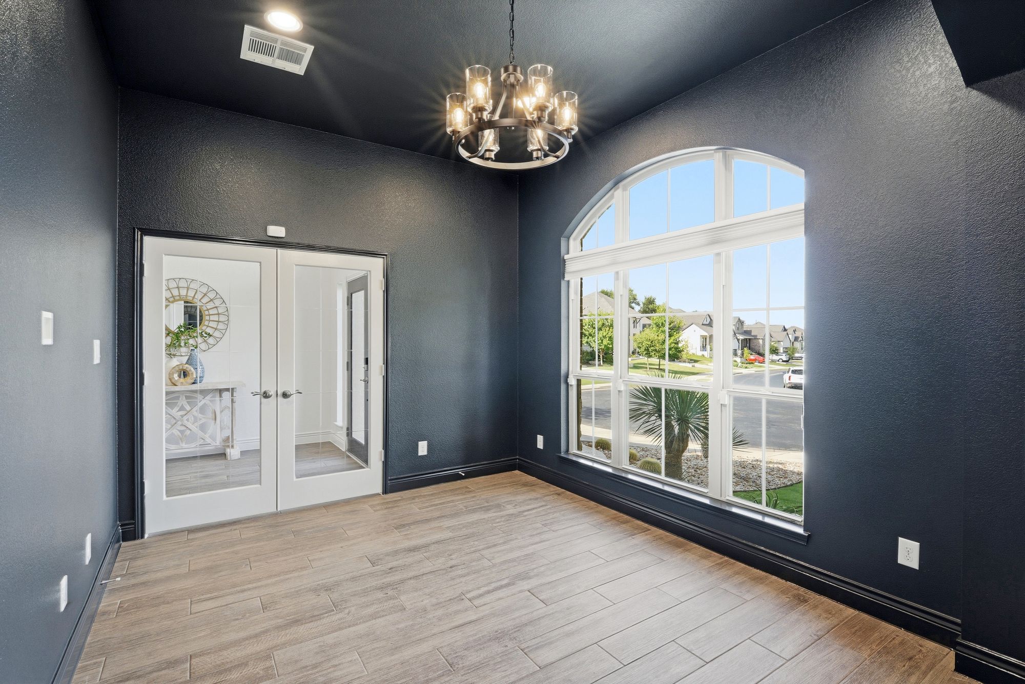 Front office with French doors and an arched window