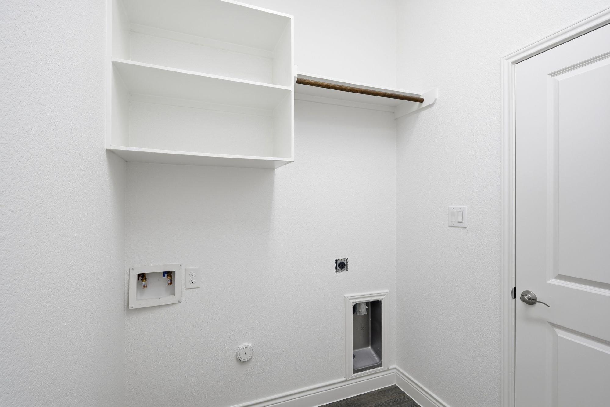 Laundry room with shelving
