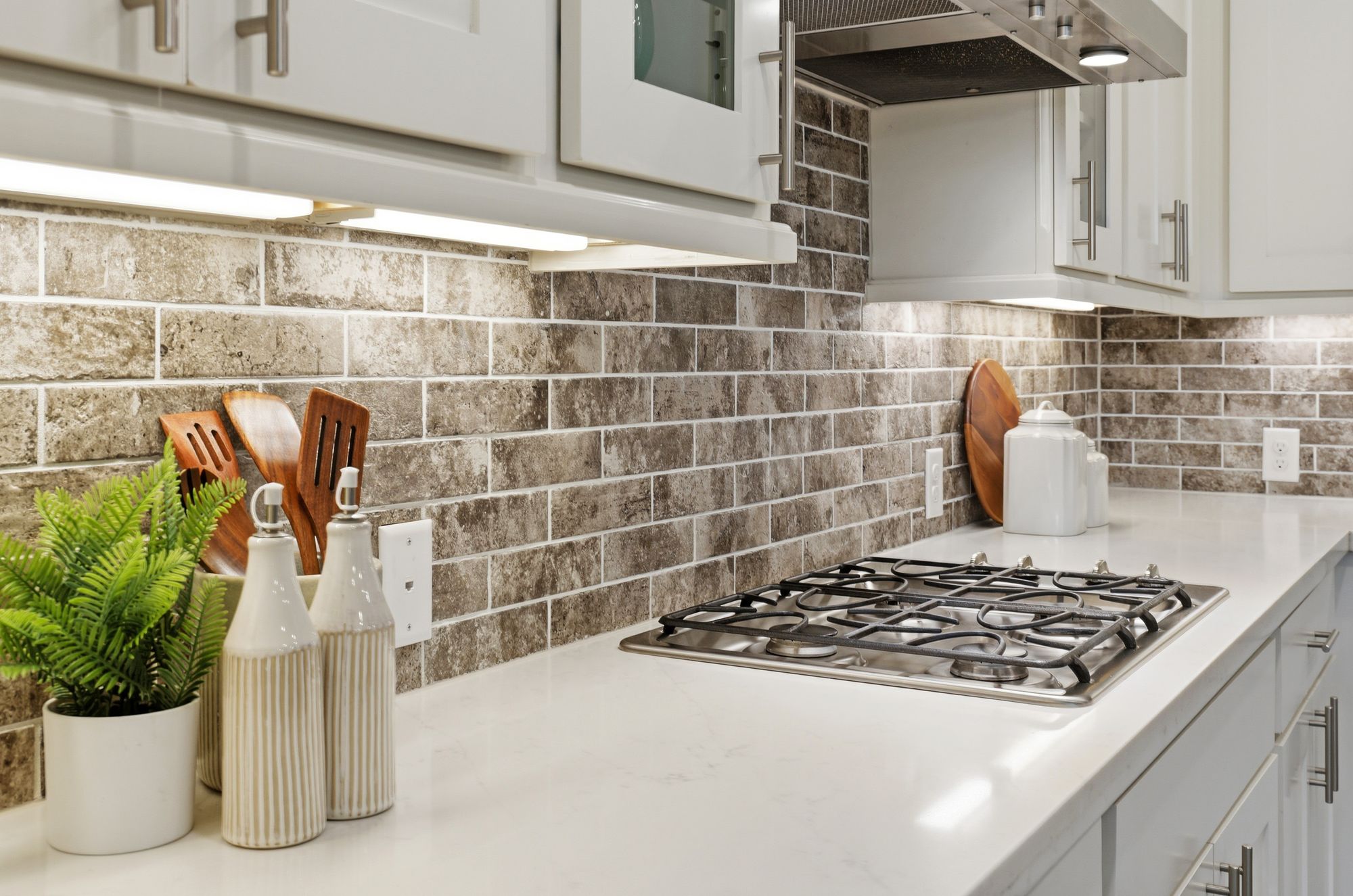 Gas cooktop and brick-tone backsplash