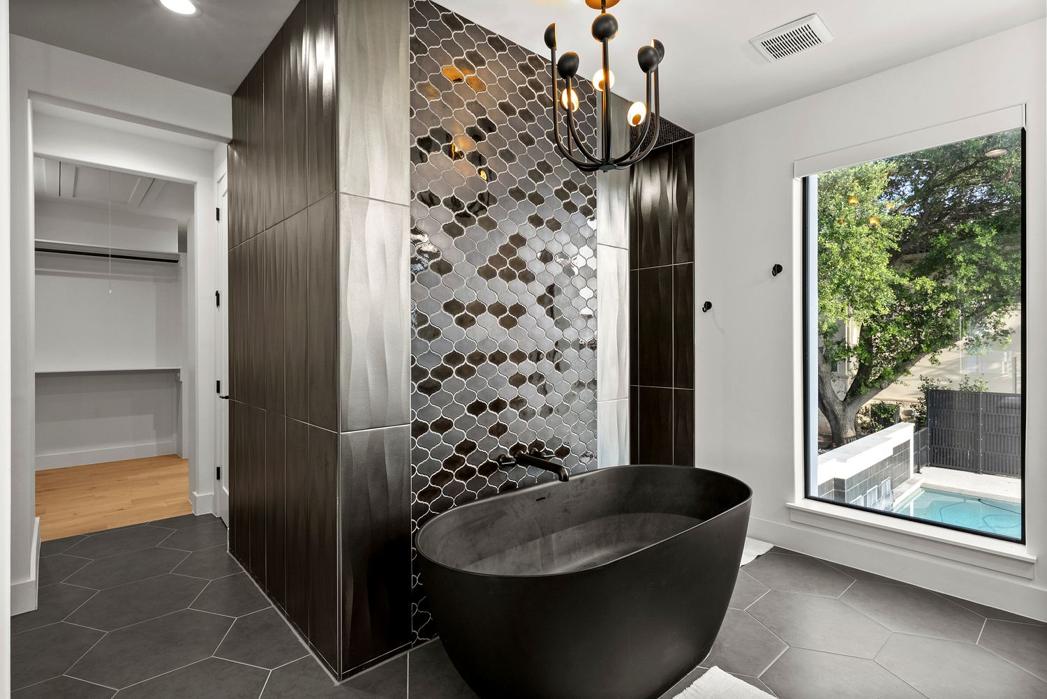 Spa bath with freestanding soaking tub and dual vanity