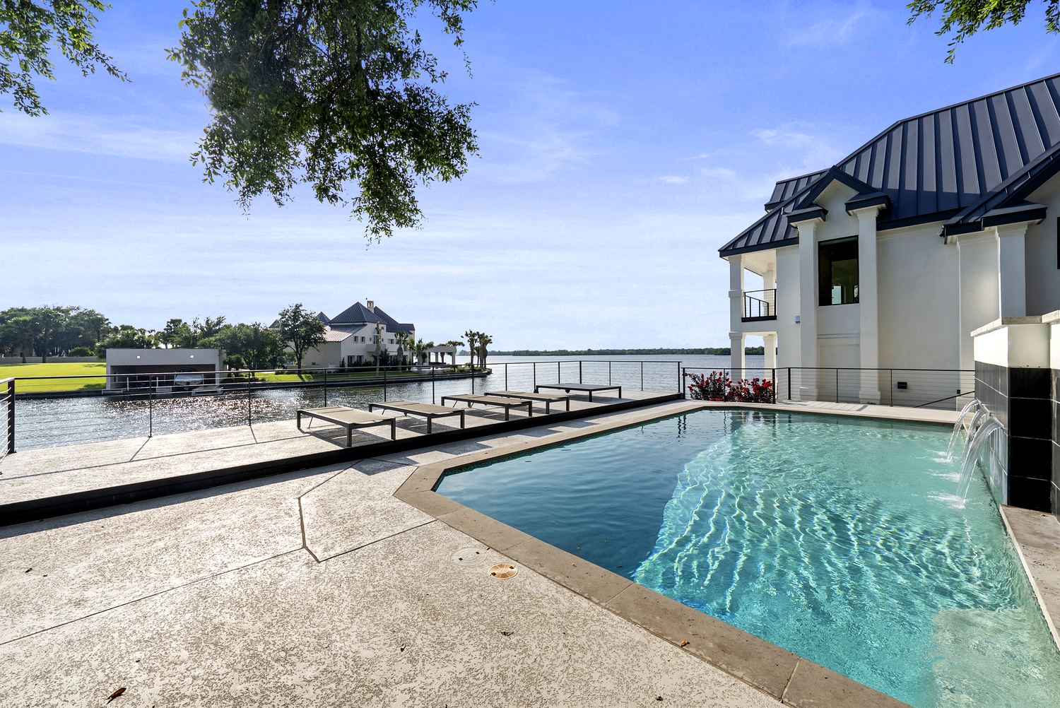 Pool with lake backdrop