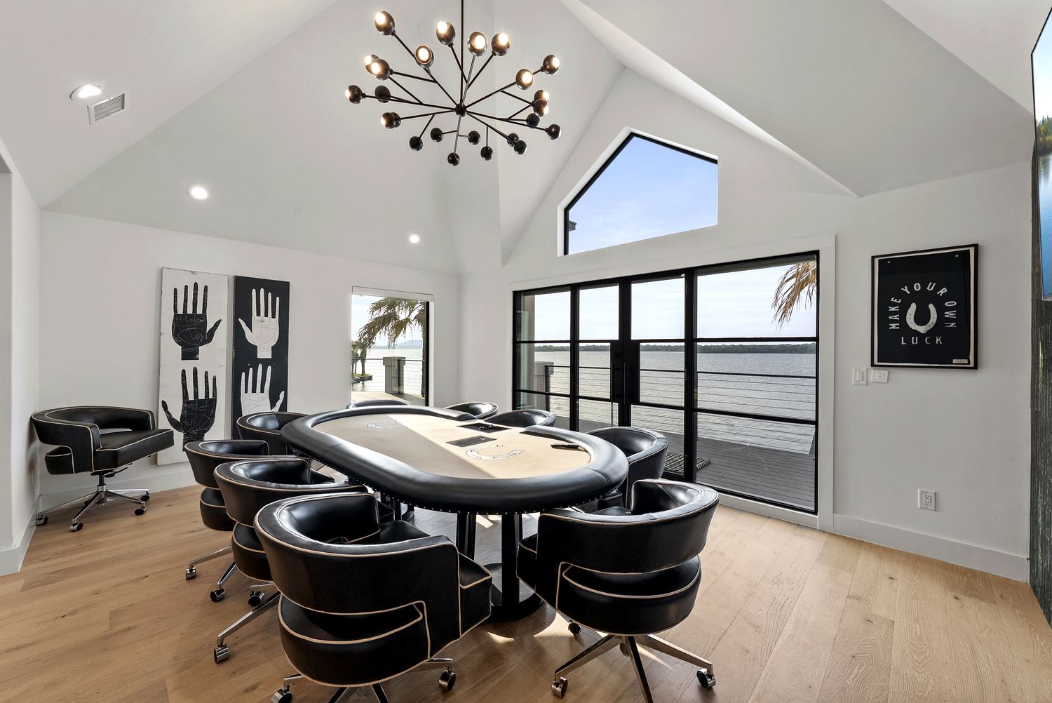 Game and card room beneath a statement chandelier